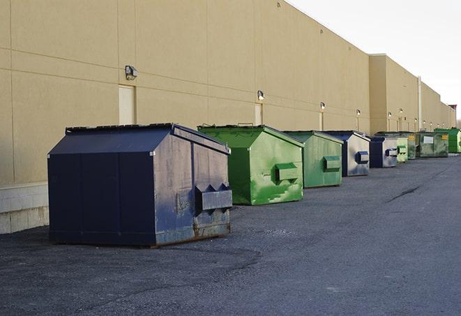 brightly colored dumpsters filled with construction waste in Alpine